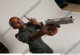 ERIC KNEELING POSE WITH GUNS